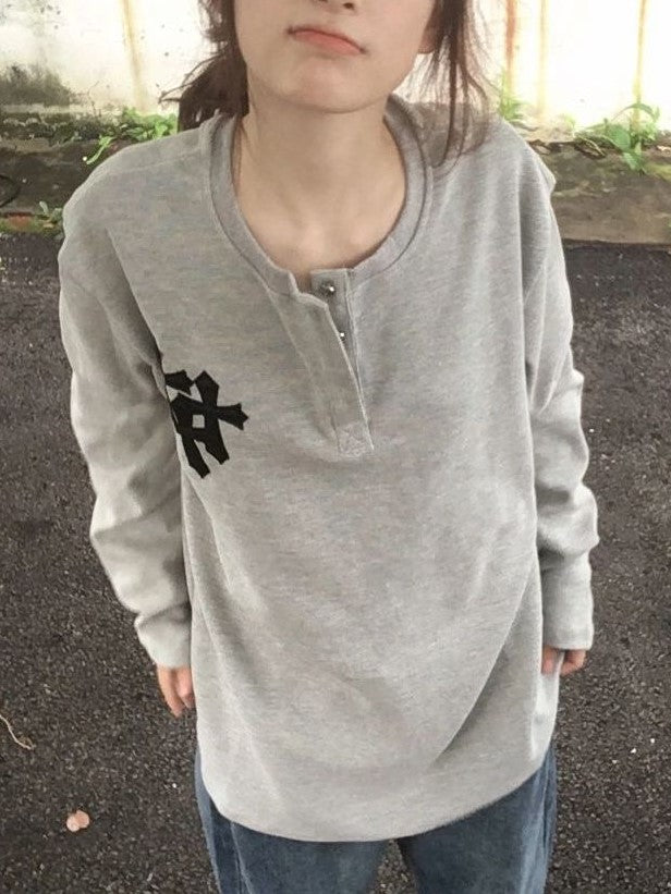 GRAY HOODIE AND JEANS OUTFIT WITH BOLD CROSS PRINT