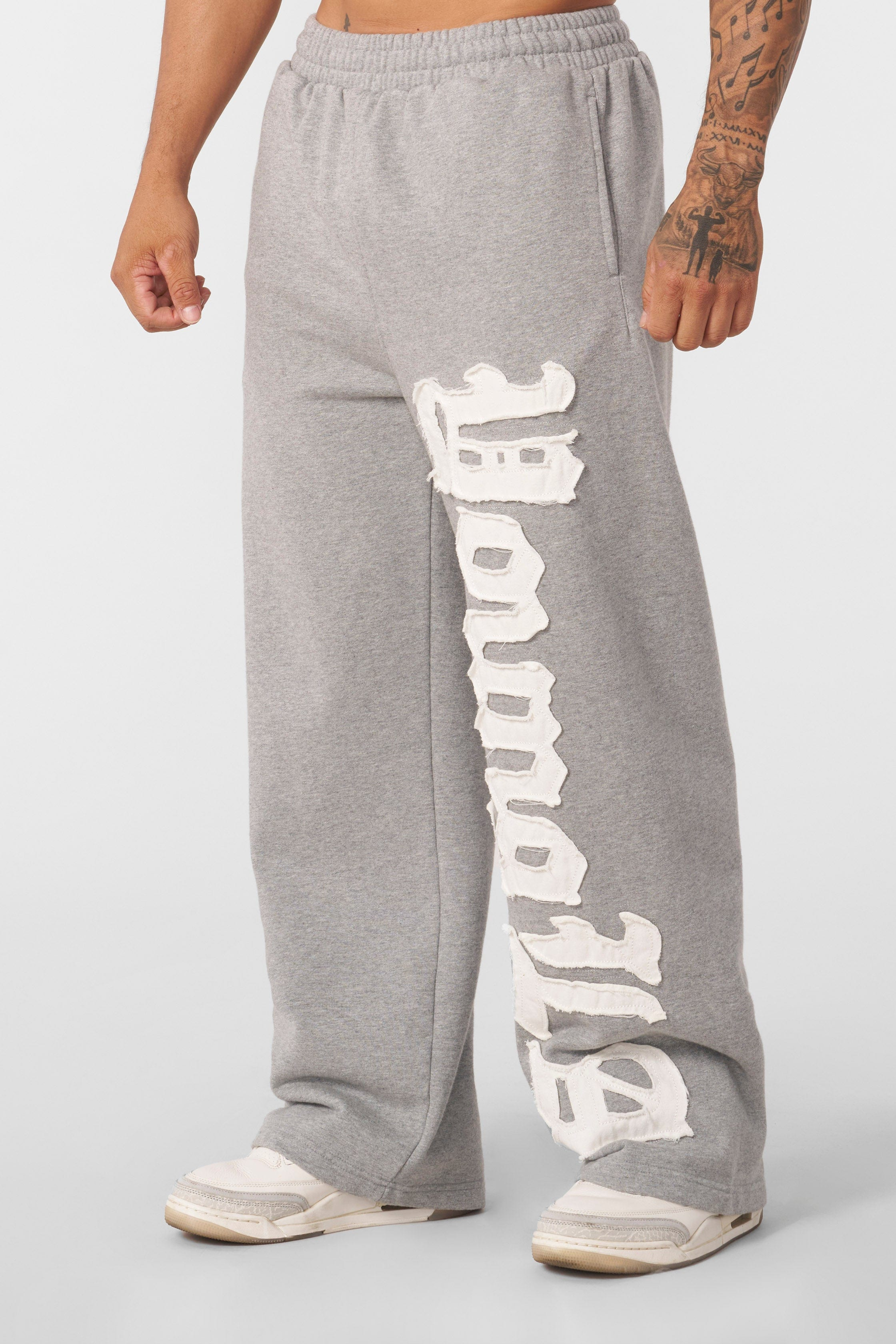 GRAY UNISEX SWEATPANTS WITH WHITE LETTERING FOR ULTIMATE COMFORT