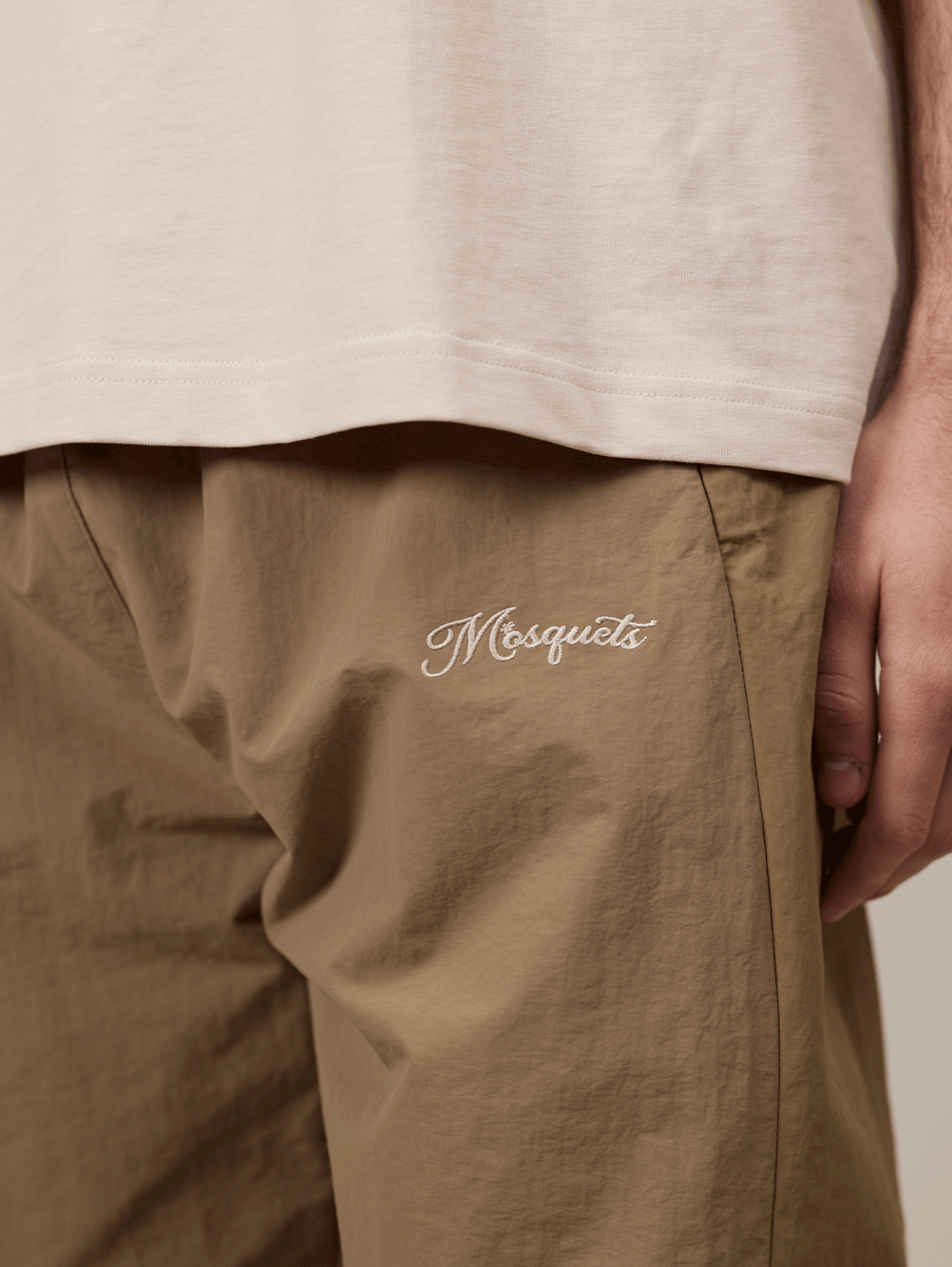 KHAKI TRACK PANTS WITH BEIGE CONTRAST CRINKLE DETAIL
