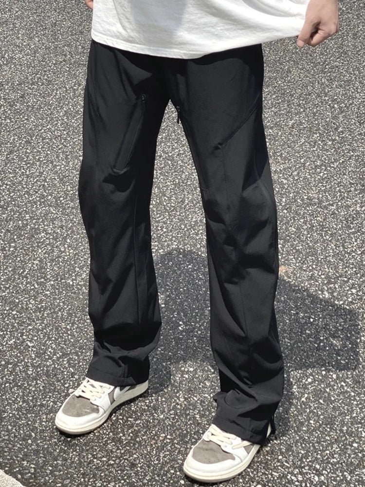 ATHLETIC PANTS WITH ZIPPERED POCKETS