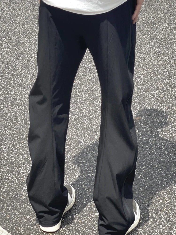 ATHLETIC PANTS WITH ZIPPERED POCKETS