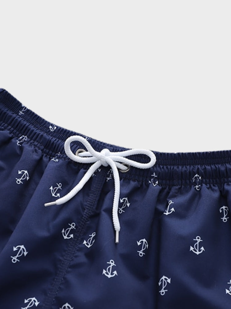 NAVY BLUE ANCHOR-PATTERNED SWIM TRUNKS WITH COMFORTABLE STRETCH FIT