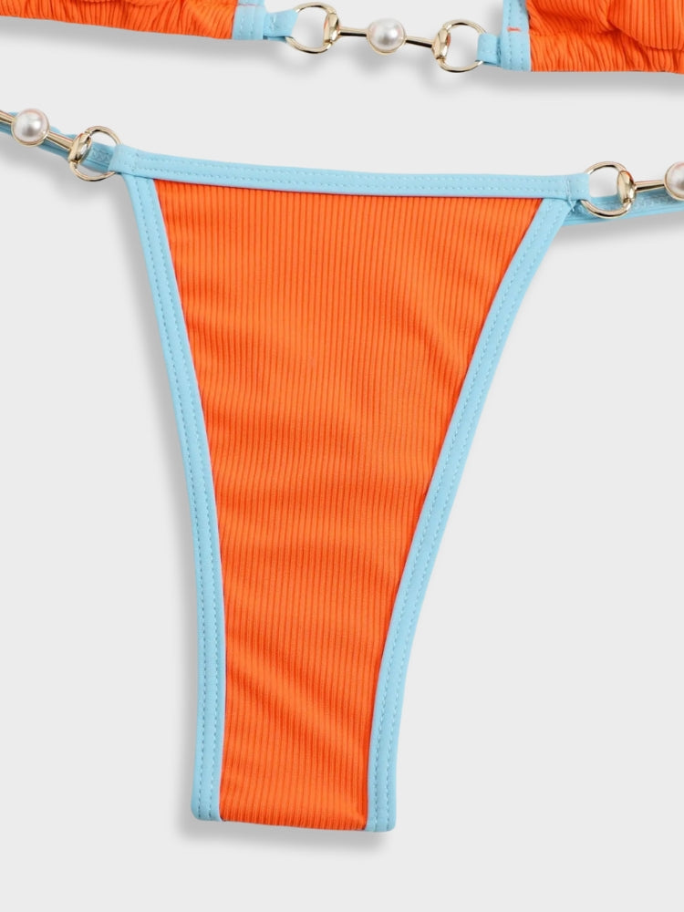 ORANGE AND BLUE BIKINI WITH SIZING GUIDE FOR OPTIMAL FIT