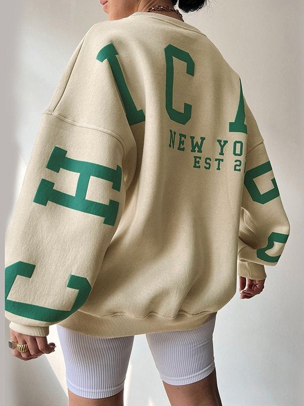 OVERSIZED BEIGE LONG SLEEVE CREW SWEATSHIRT WITH GREEN LETTERING