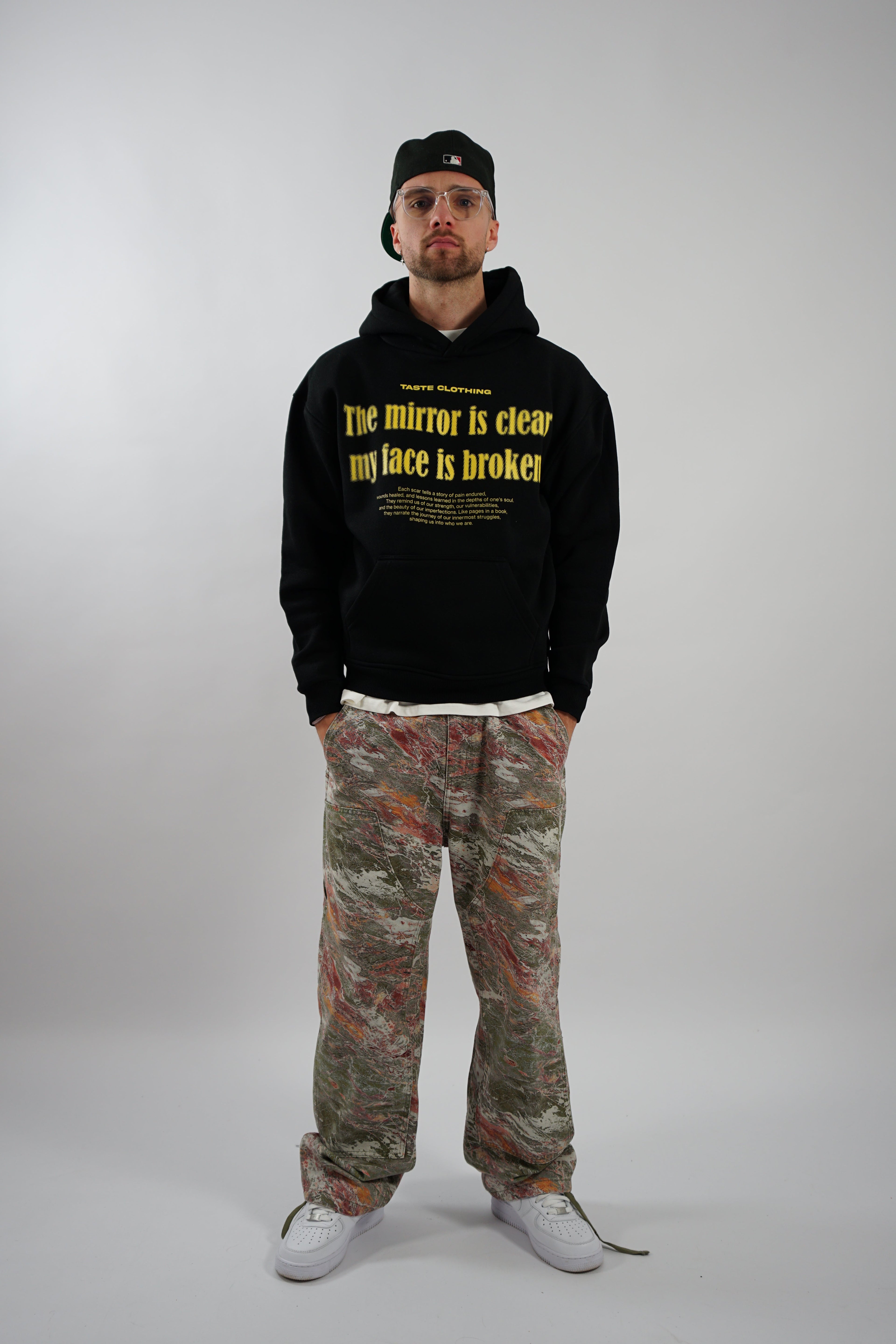 OVERSIZED FIT BLACK HOODIE WITH PRINTED POCKET AND YELLOW TEXT