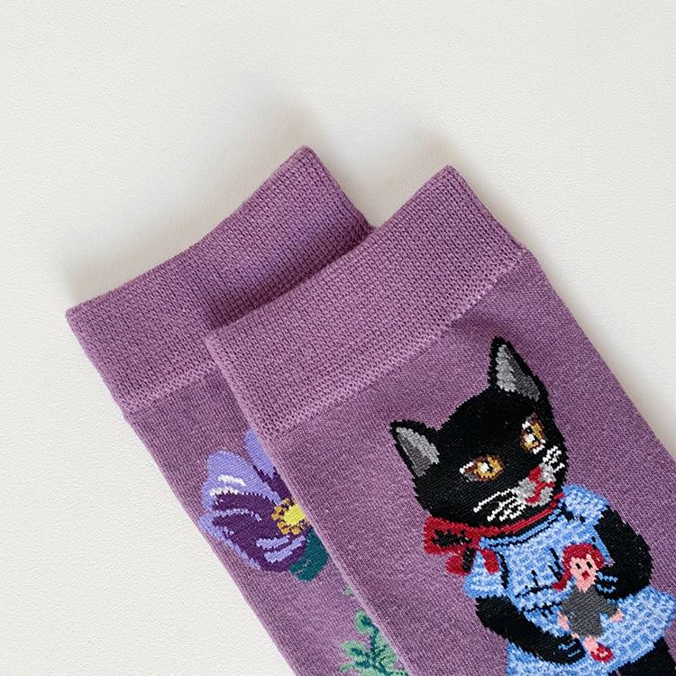 PAIR OF PURPLE SOCKS WITH FLORAL AND CAT DESIGNS FEATURING LISA BLACK PINK