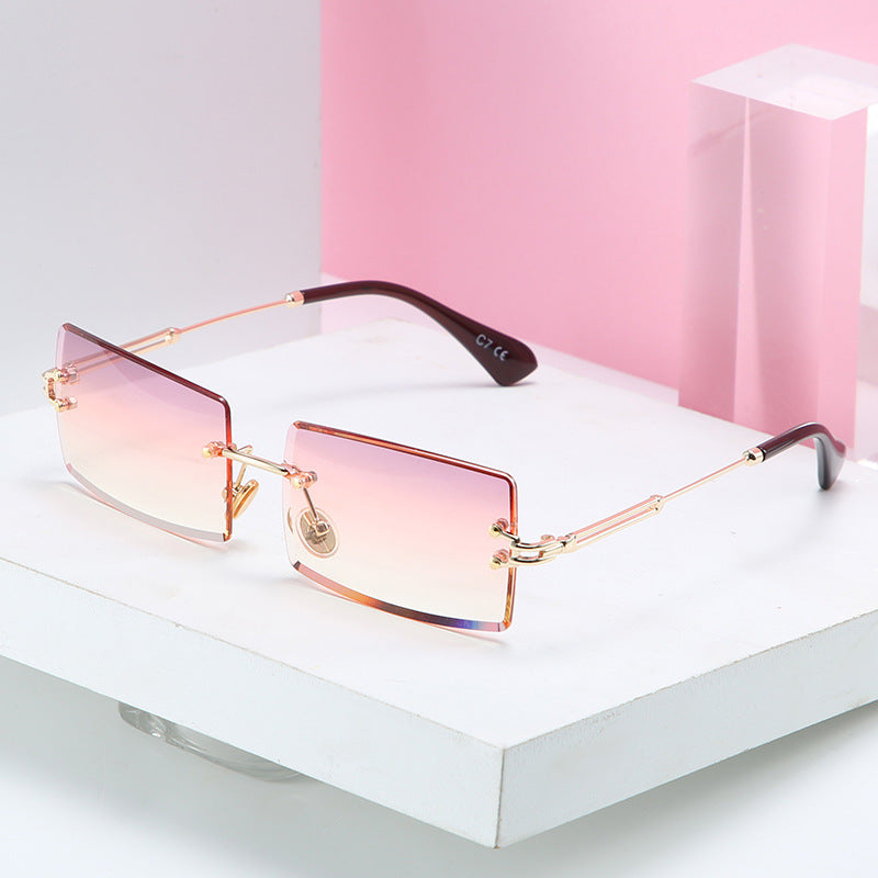 RIMLESS RECTANGULAR SUNGLASSES WITH DARK LENSES AND ITALIAN ACETAT