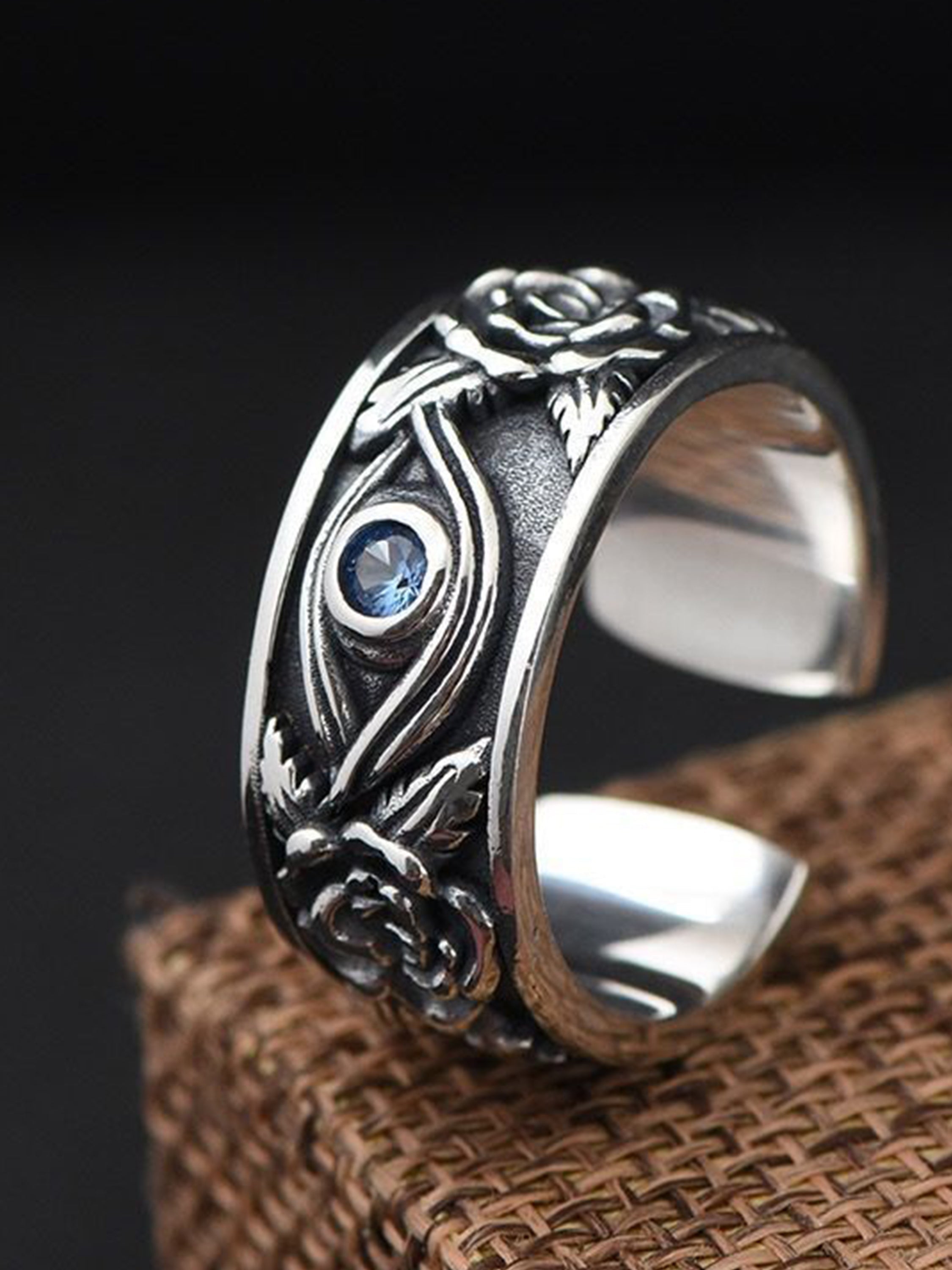 SILVER EYE RING WITH ROSES AND BLUE GEMSTONE - GOD’S EYE DESIGN