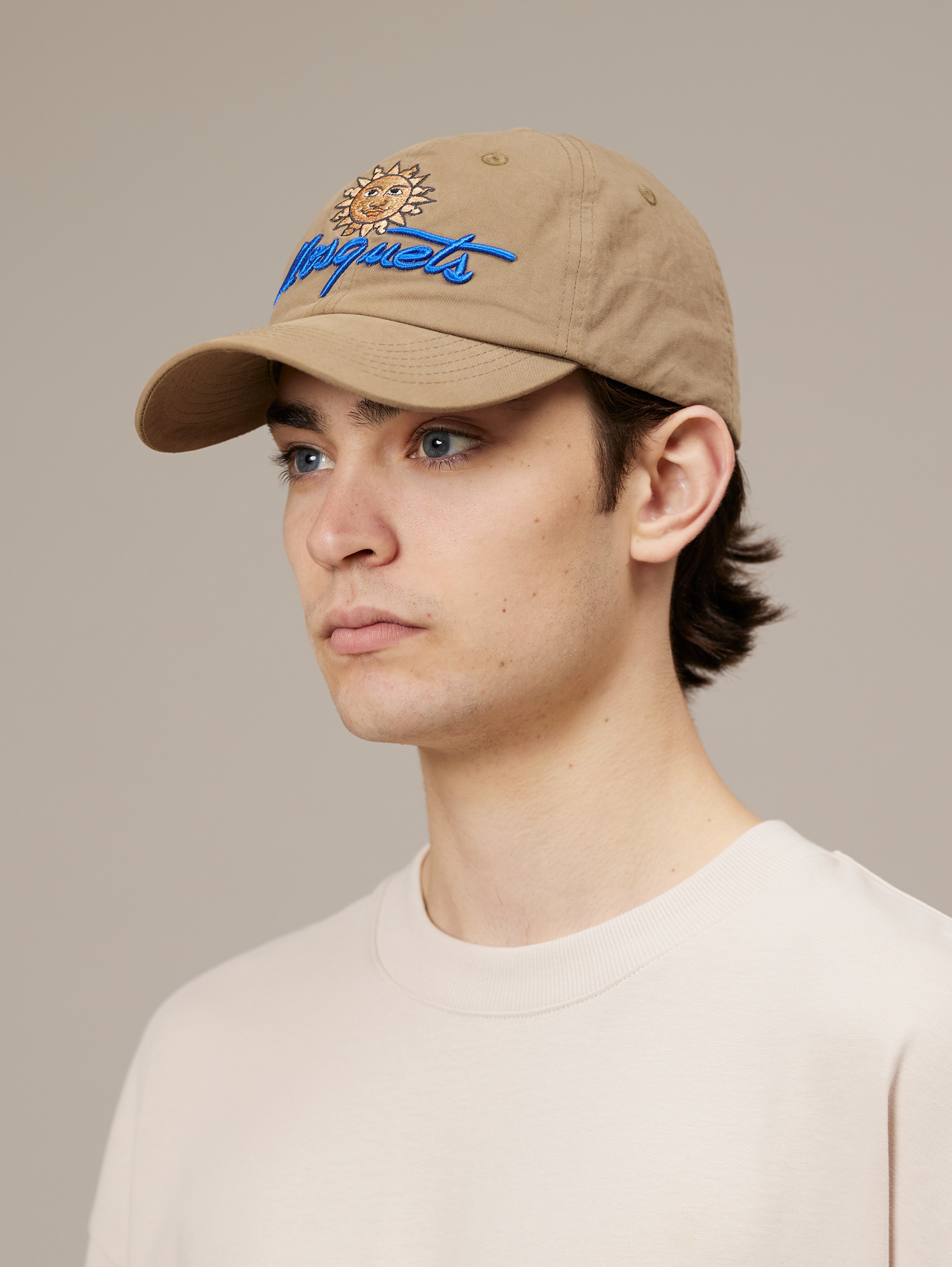 TAN BASEBALL CAP WITH SUN AND SCRIPT LEATHER SNAP CLOSURE