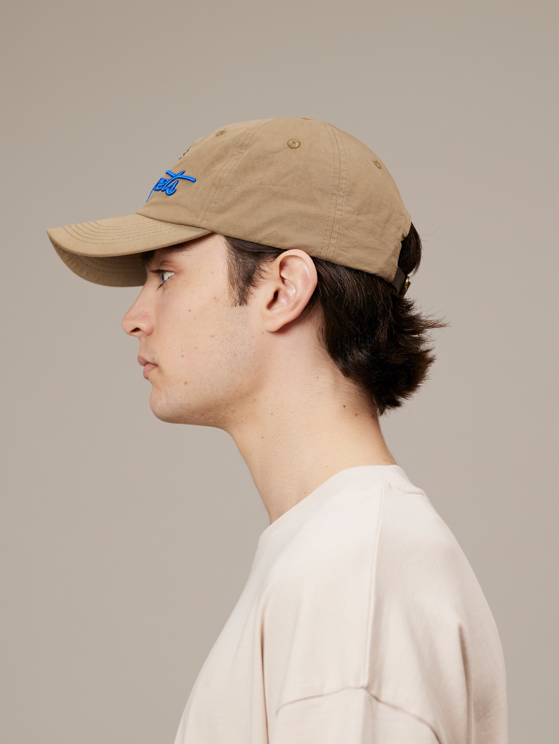 TAN BASEBALL CAP WITH SUN AND SCRIPT LEATHER SNAP CLOSURE