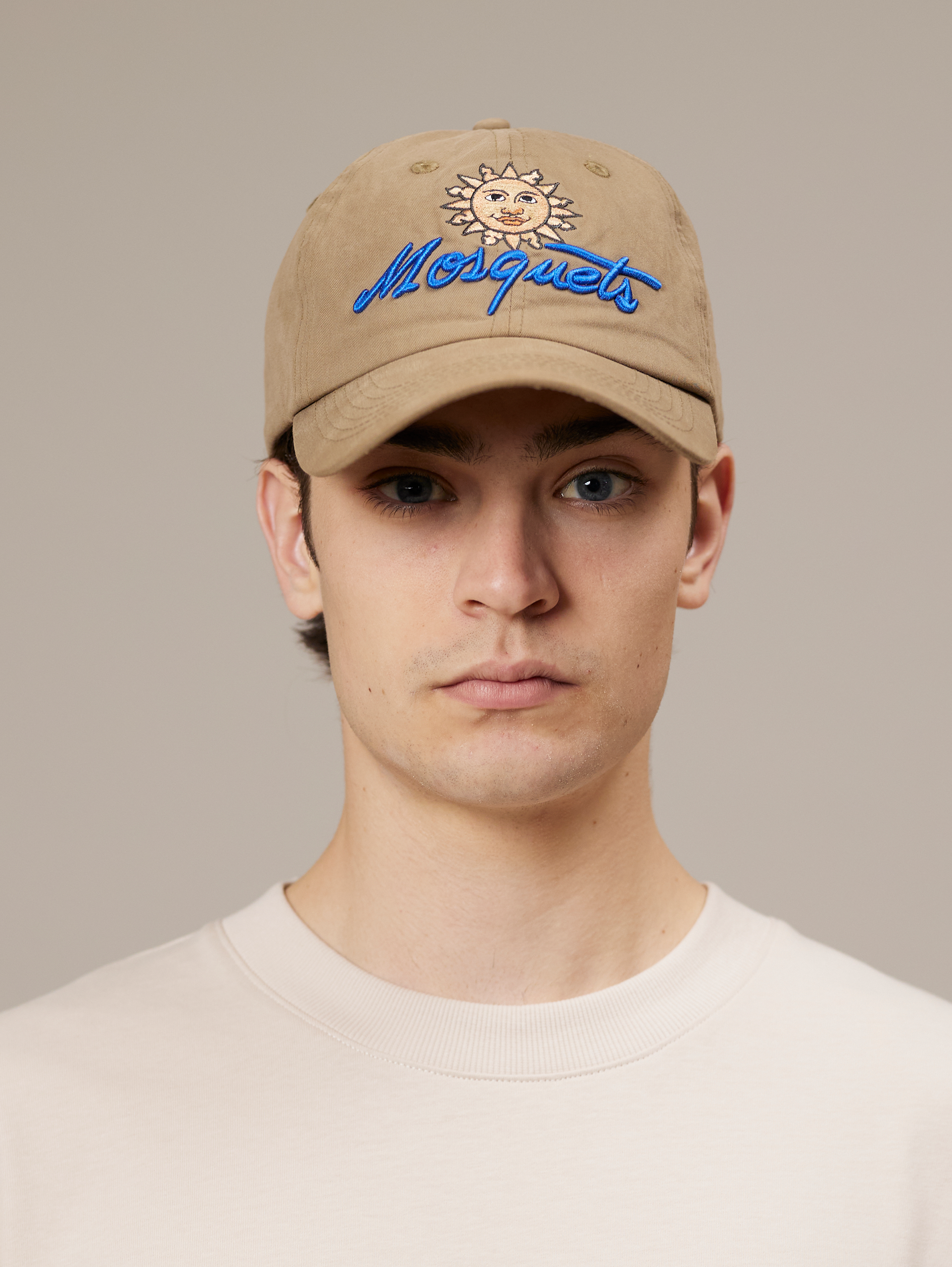 TAN BASEBALL CAP WITH SUN AND SCRIPT LEATHER SNAP CLOSURE