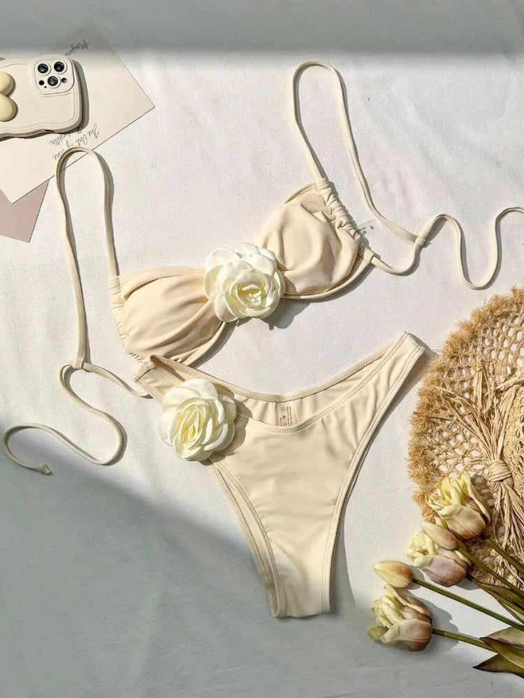 TWO-PIECE BROWN SWIMSUIT WITH WHITE FLOWER ACCENTS AND SIZE GUIDE