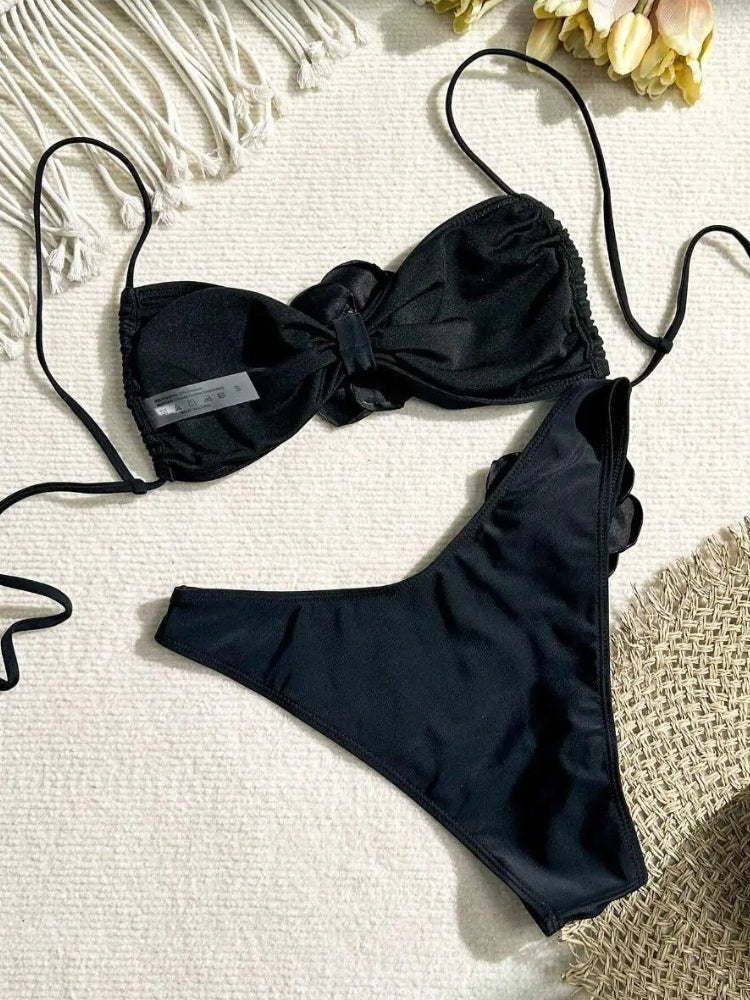 TWO-PIECE BROWN SWIMSUIT WITH WHITE FLOWER ACCENTS AND SIZE GUIDE