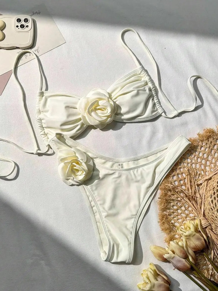 TWO-PIECE BROWN SWIMSUIT WITH WHITE FLOWER ACCENTS AND SIZE GUIDE