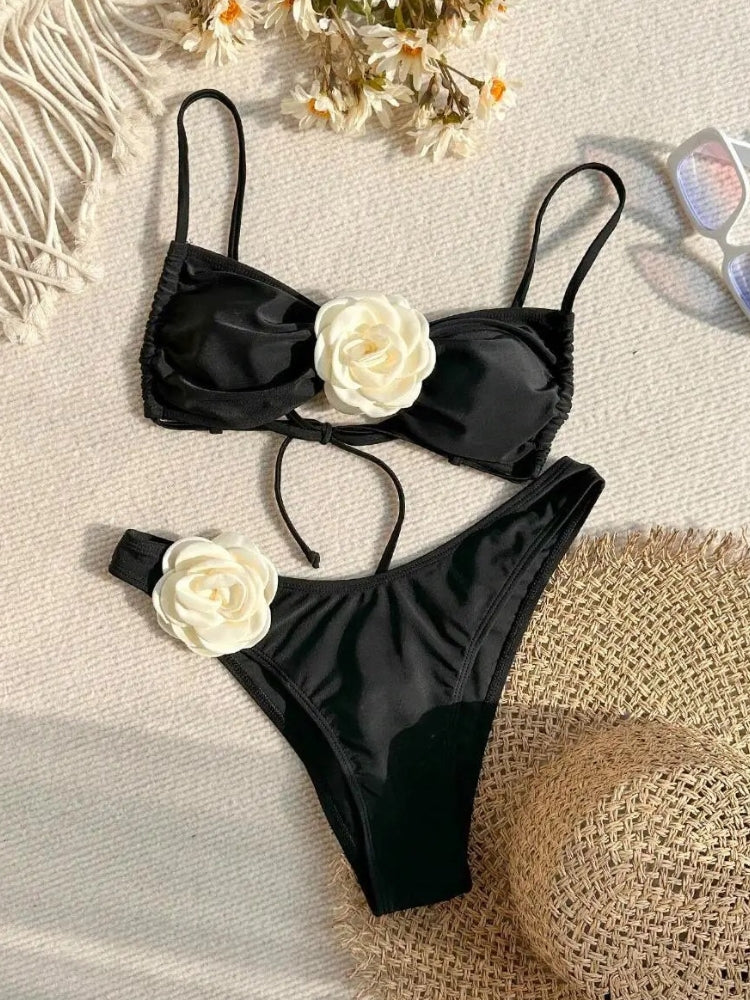 TWO-PIECE BROWN SWIMSUIT WITH WHITE FLOWER ACCENTS AND SIZE GUIDE