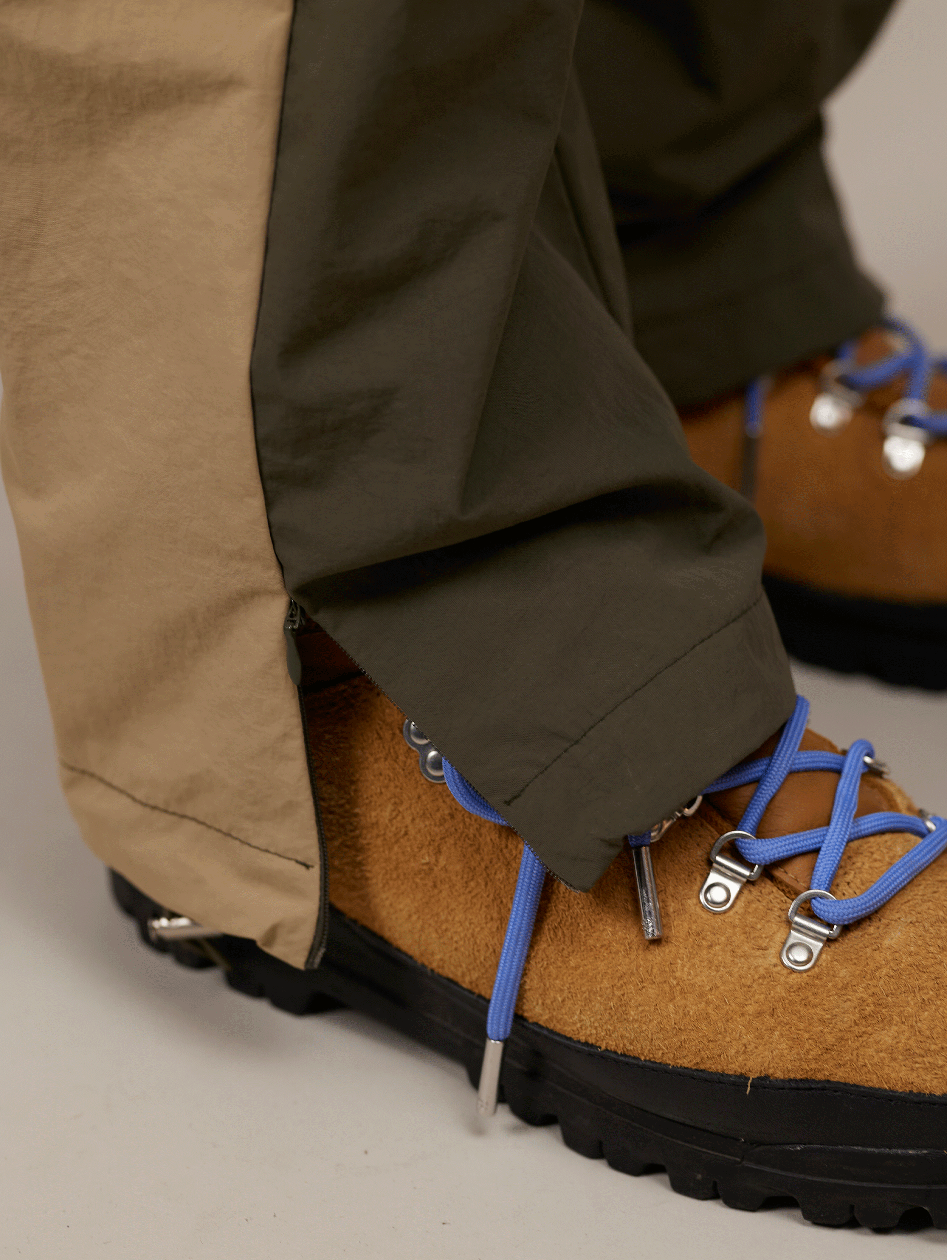 TWO-TONE TRACK PANTS WITH BEIGE EMBROIDERY AND NYLON GREEN ACCENTS