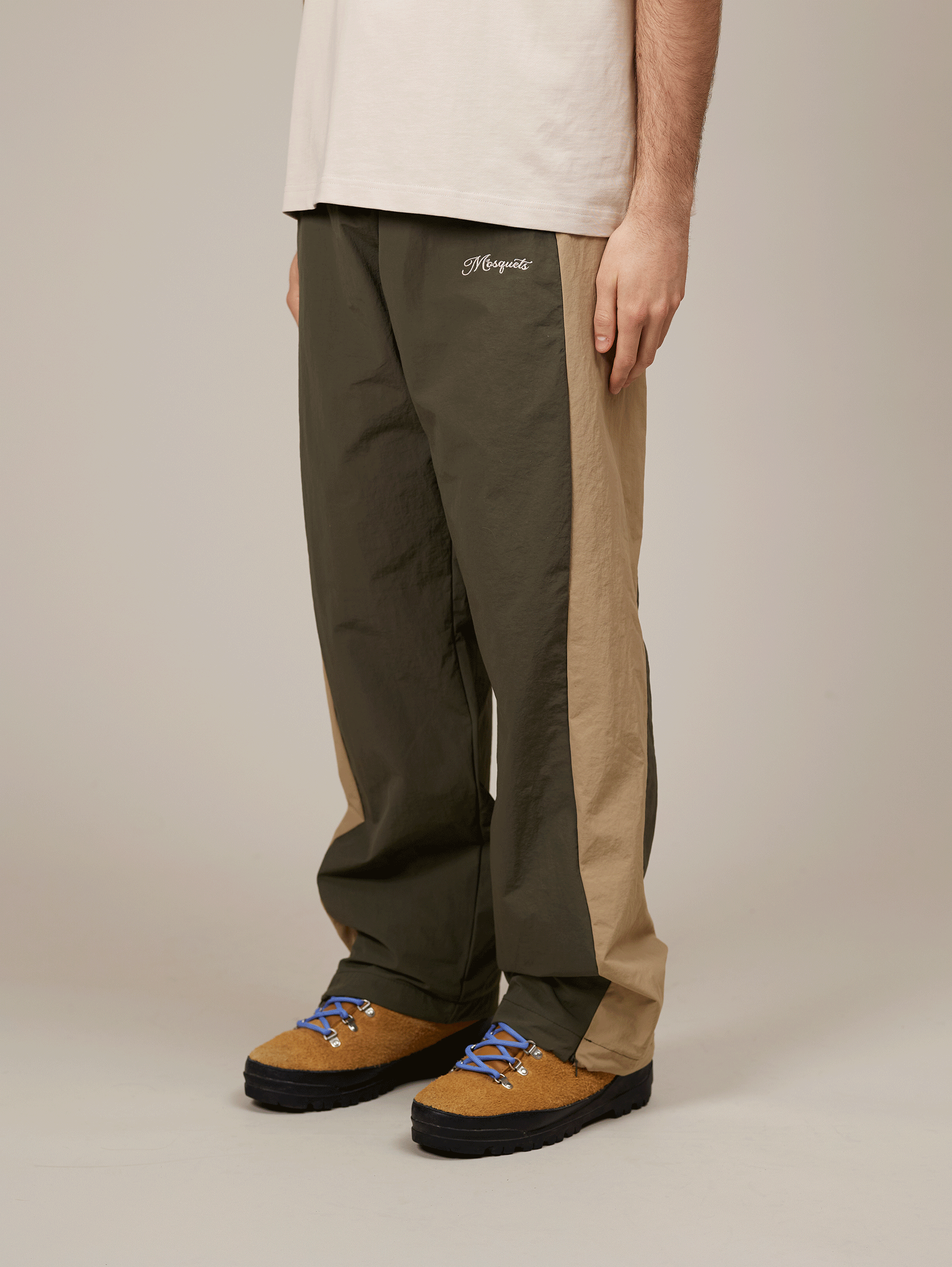 TWO-TONE TRACK PANTS WITH BEIGE EMBROIDERY AND NYLON GREEN ACCENTS