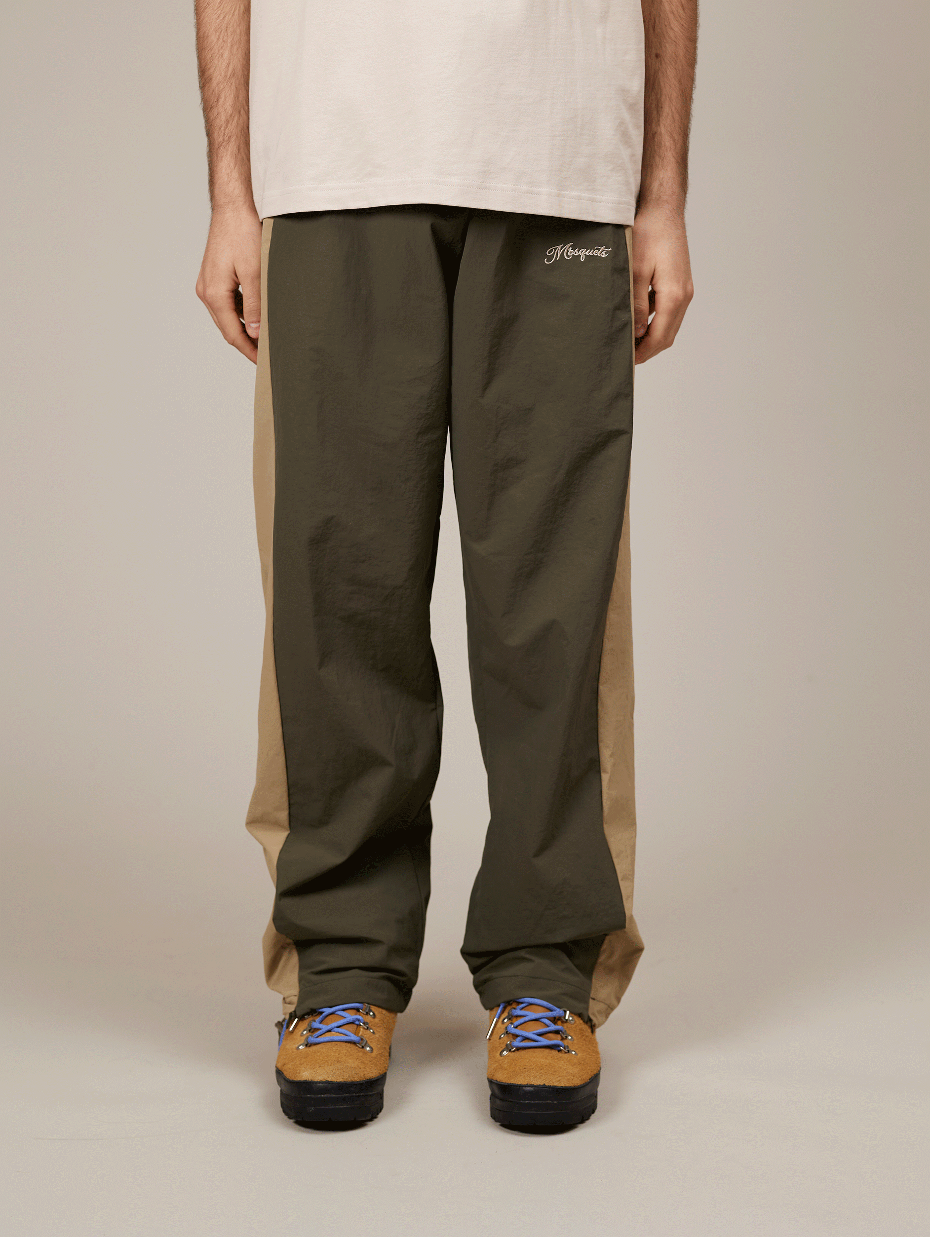 TWO-TONE TRACK PANTS WITH BEIGE EMBROIDERY AND NYLON GREEN ACCENTS