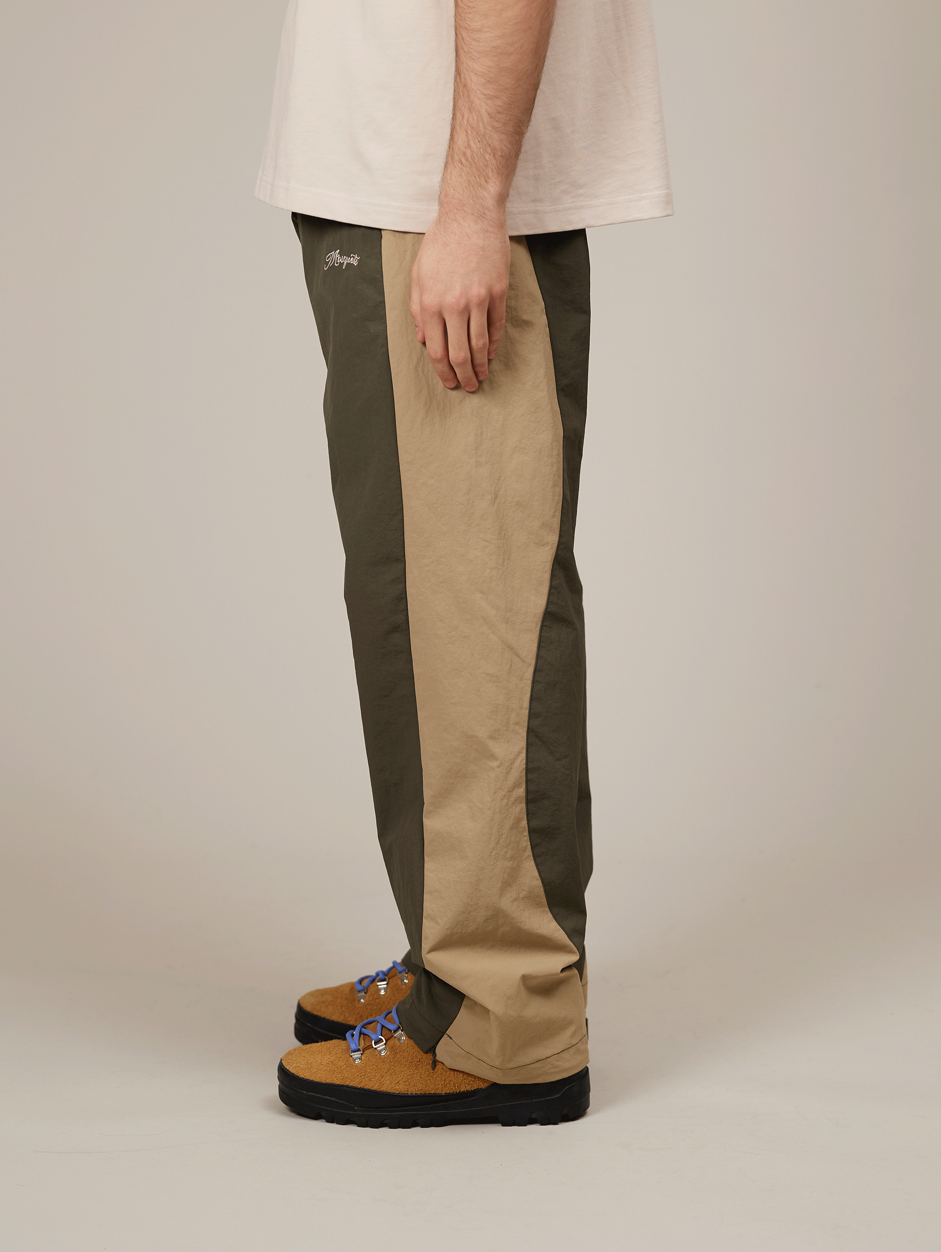 TWO-TONE TRACK PANTS WITH BEIGE EMBROIDERY AND NYLON GREEN ACCENTS