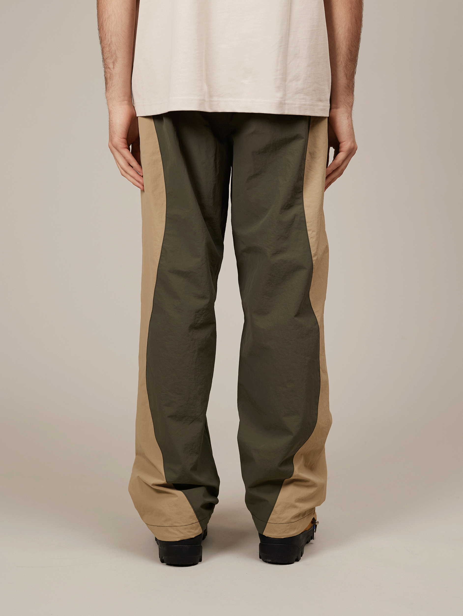 TWO-TONE TRACK PANTS WITH BEIGE EMBROIDERY AND NYLON GREEN ACCENTS