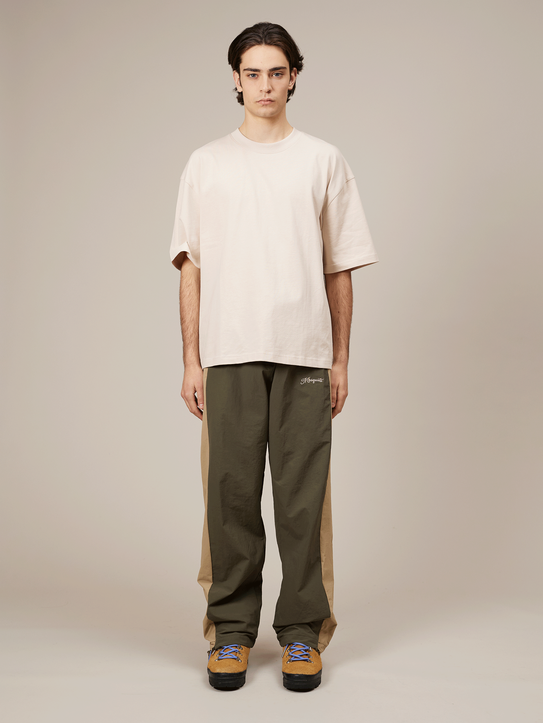TWO-TONE TRACK PANTS WITH BEIGE EMBROIDERY AND NYLON GREEN ACCENTS