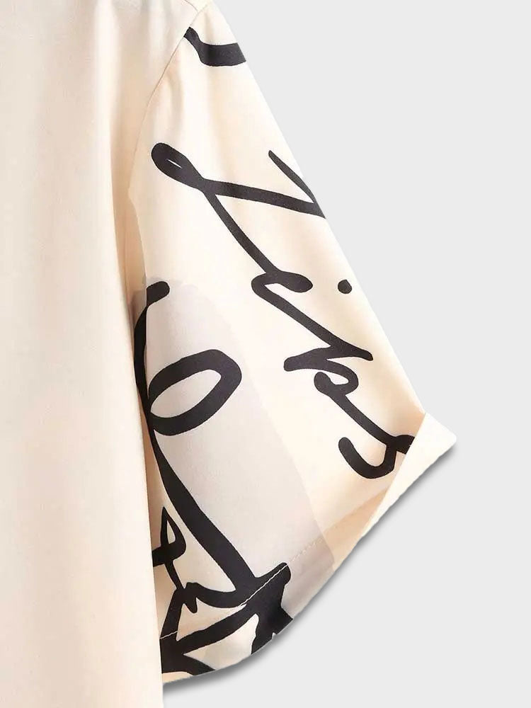 TWO-TONED SHORT-SLEEVED SHIRT WITH ROSE AND ABSTRACT FACE DESIGN