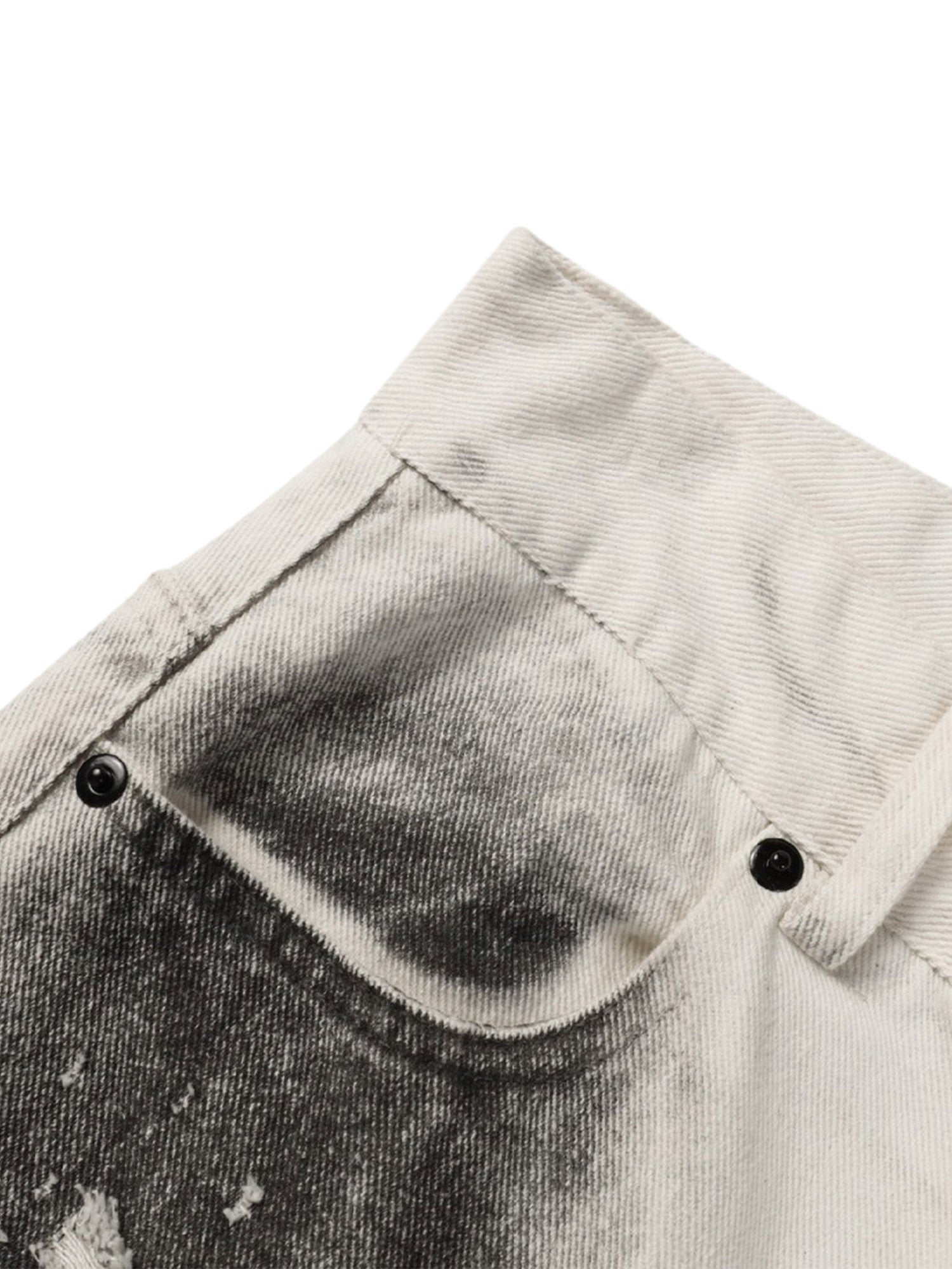 WASHED WHITE JEANS WITH DARK GRAY SPLOTCHES AND BLACK STAINS WASHED
