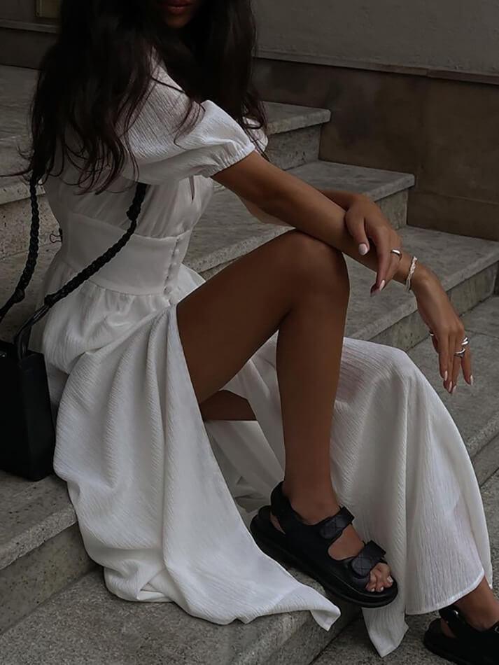 WHITE MAXI DRESS WITH THIGH-HIGH SLIT AND PUFF SLEEVE DETAILS