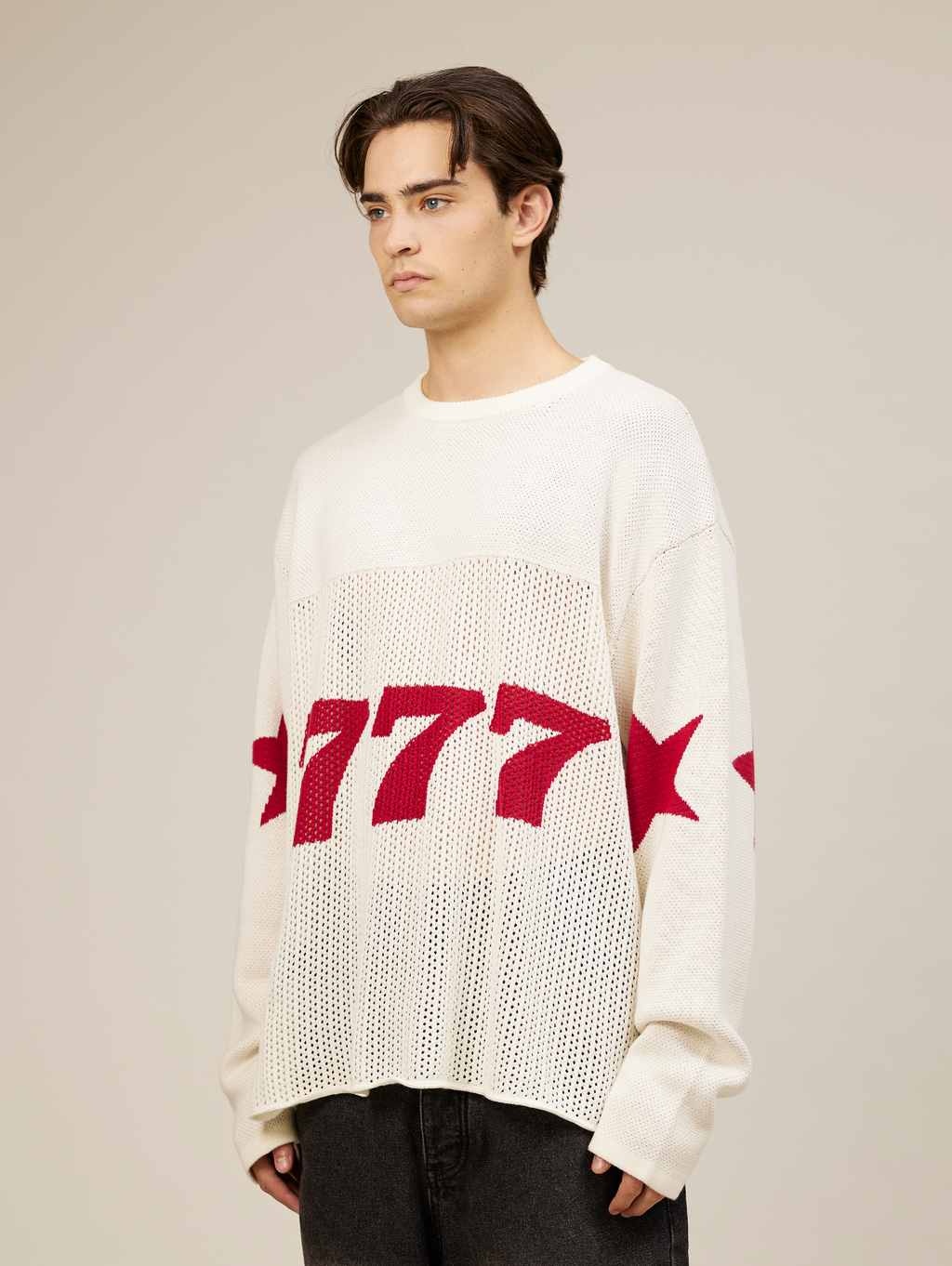 WHITE OVERSIZED KNIT SWEATER WITH RED STARS AND NUMBER 777