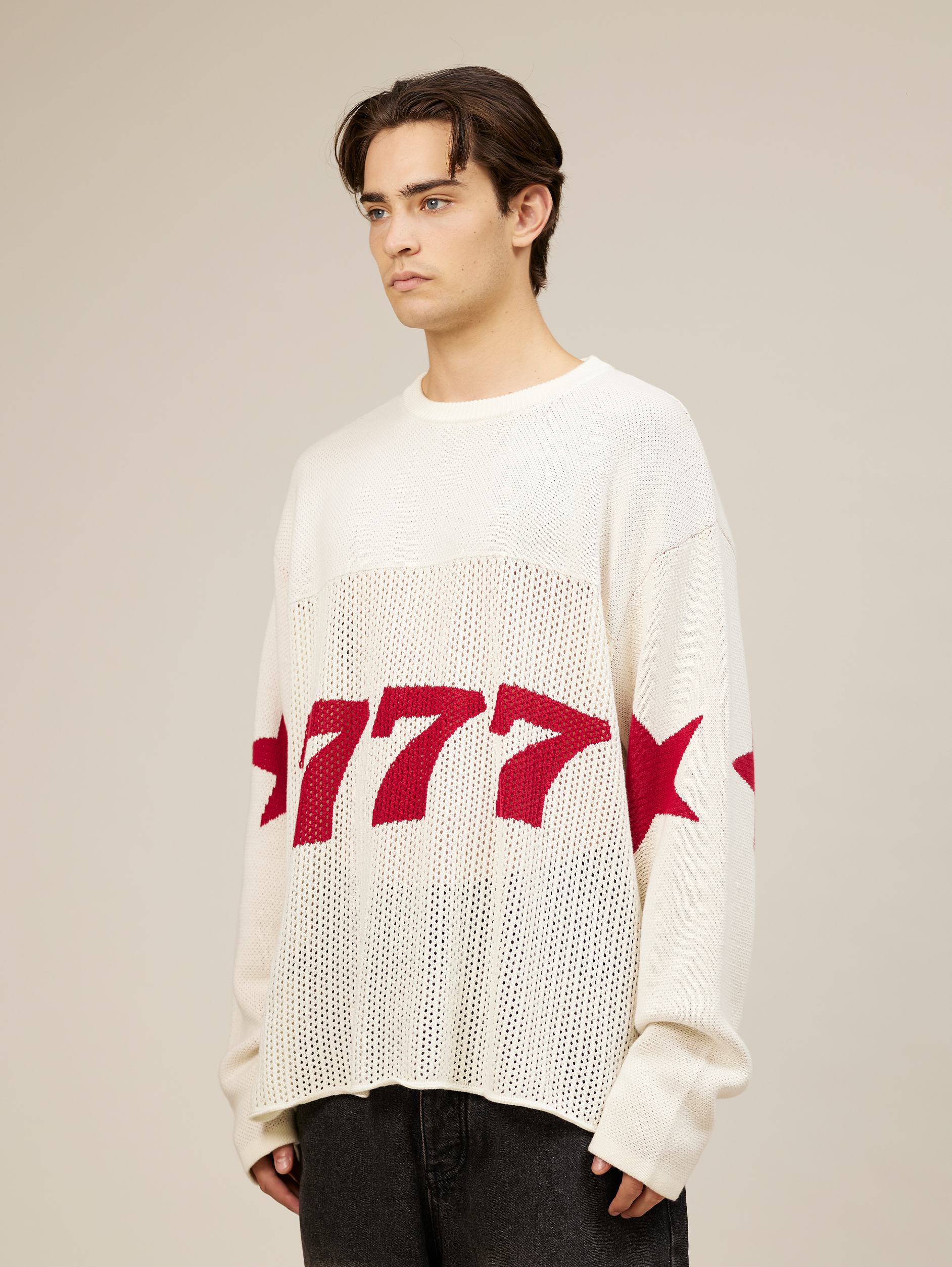 WHITE OVERSIZED KNIT SWEATER WITH RED STARS AND NUMBER 777