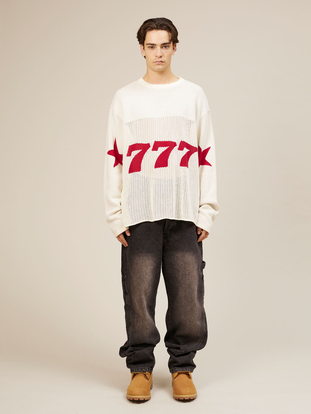 WHITE OVERSIZED KNIT SWEATER WITH RED STARS AND NUMBER 777