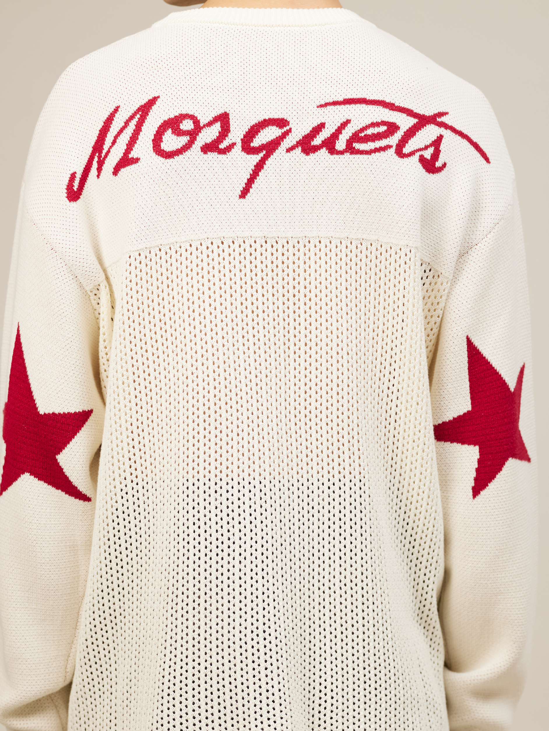 WHITE OVERSIZED KNIT SWEATER WITH RED STARS AND NUMBER 777