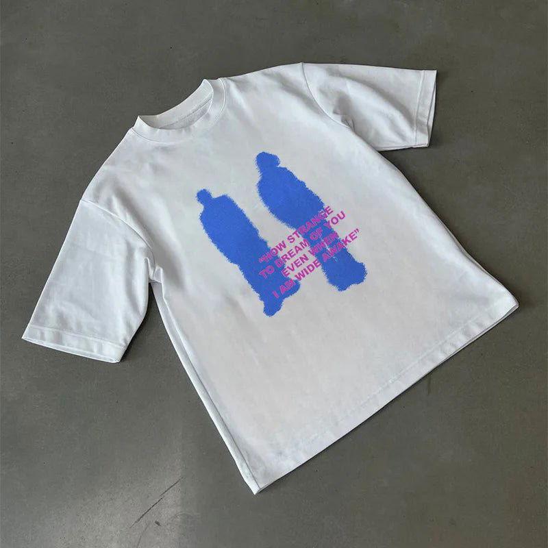 WHITE TEE SHIRT WITH BLUE FIGURES AND PINK TEXT - STYLISH TEE